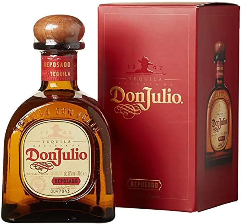 An image of a bottle of Don Julio Reposado Tequila next to its fine gift box