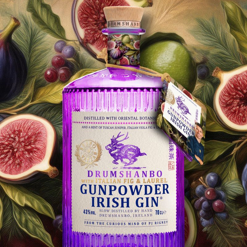 Drumshanbo Gunpowder Irish Gin Bruno Vanzan Edition bottle surrounded by figs and other fruits on a decorative background