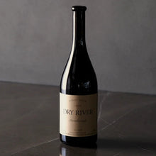 Load image into Gallery viewer, Dry-River-Pinot-Noir wine bottle on a reflective surface with a neutral background