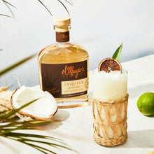 Load image into Gallery viewer, El Mayor Reposado Tequila bottle with a cocktail garnished with lime and coconut on a light background