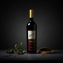 Load image into Gallery viewer, Elderton-Command-Shiraz-lifestyle wine bottle with a dark background