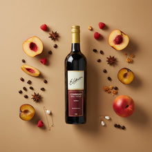Load image into Gallery viewer, A bottle of Elderton Command Shiraz wine surrounded by fruits and spices on a beige background
