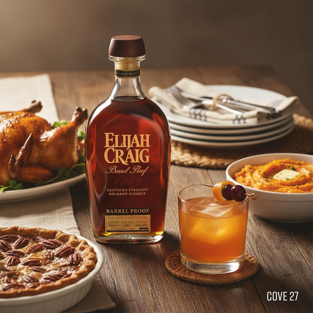 Load image into Gallery viewer, Bottle of Elijah Craig BARREL PROOF bourbon on a table with a glass of whiskey, pie, and other dishes.