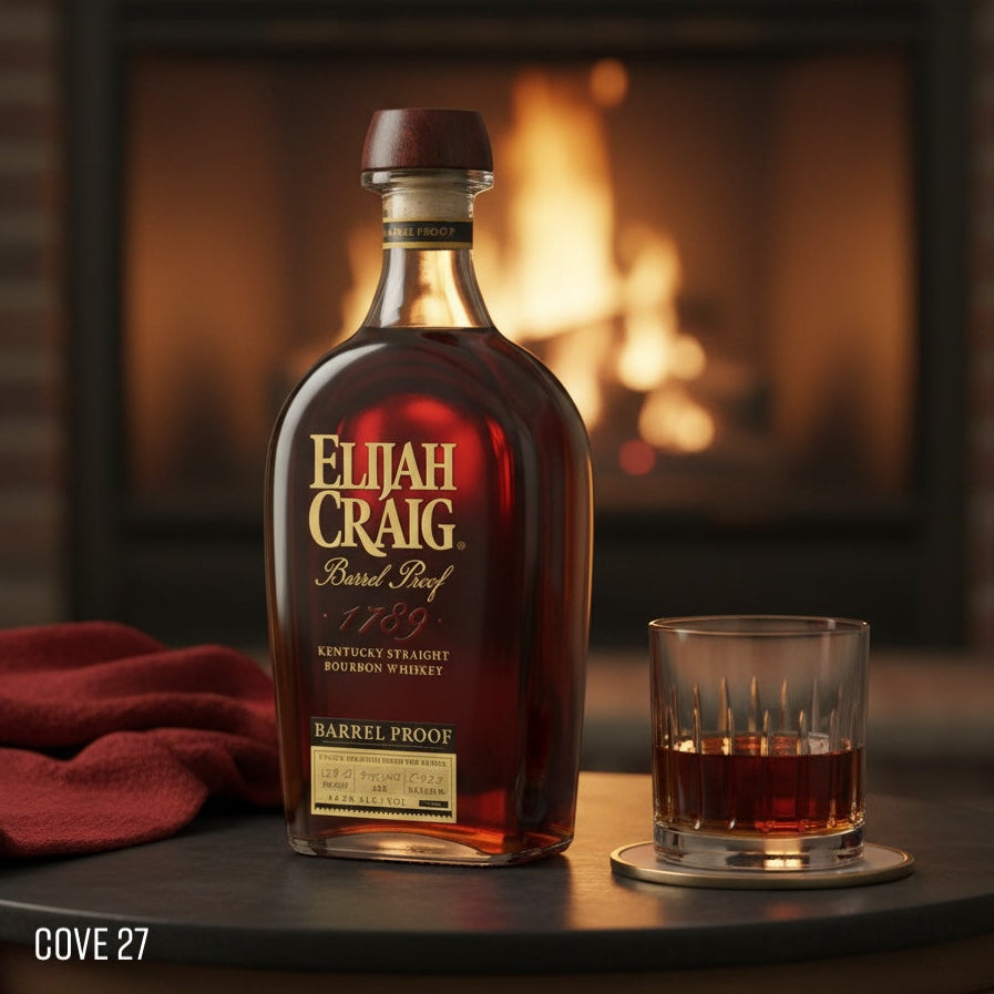 Load image into Gallery viewer, Bottle of Elijah Craig BARREL PROOF bourbon whiskey with a glass on a table in front of a fireplace.