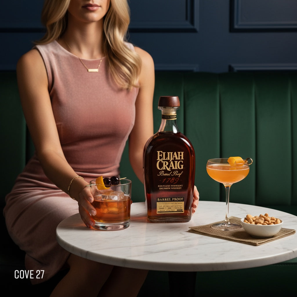 Load image into Gallery viewer, Woman holding a bottle of Elijah Craig BARREL PROOF bourbon with cocktails on a table.
