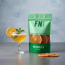 Load image into Gallery viewer, Green package of oranges with cocktail and slices on a gray background