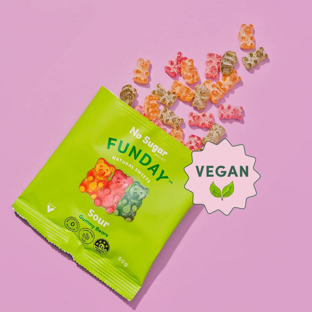 Load image into Gallery viewer, A bright green bag of Funday Sour Vegan Gummy Bears on a pink background, with several colourful gummy bears scattered above the package and a white badge that says VEGAN.