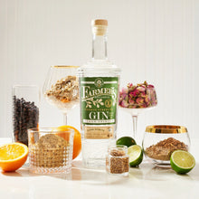 Load image into Gallery viewer, Bottle of Farmers Gin with garnishes on a white background
