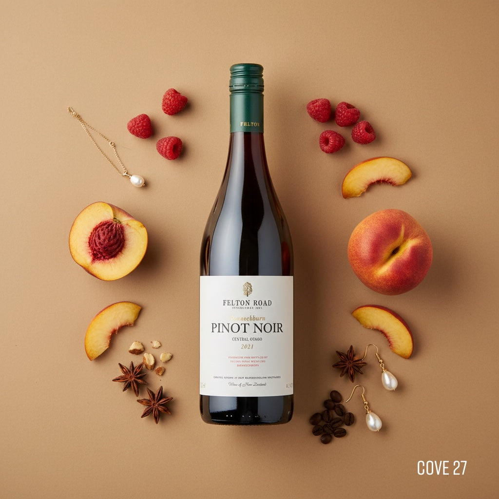 Load image into Gallery viewer, Bottle of Felton Road Pinot Noir surrounded by peaches, raspberries, and star anise on a beige background