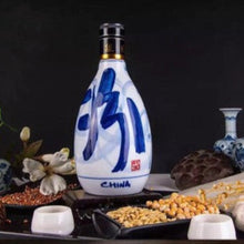 Load image into Gallery viewer, Traditional Chinese ceramic bottle with blue design on a dark background