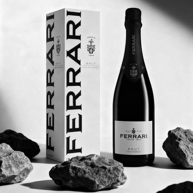 Load image into Gallery viewer, Ferrari Trento Brut Metodo Classico bottle and a branded Ferrari gift box on a white background with rocks.