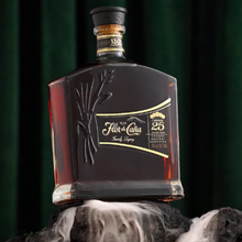 Load image into Gallery viewer, Bottle of Flor de Cana 25 year old Rum on a dark background with smoke effects