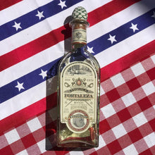 Load image into Gallery viewer, Bottle of Fortaleza tequila on a red, white, and blue checkered tablecloth