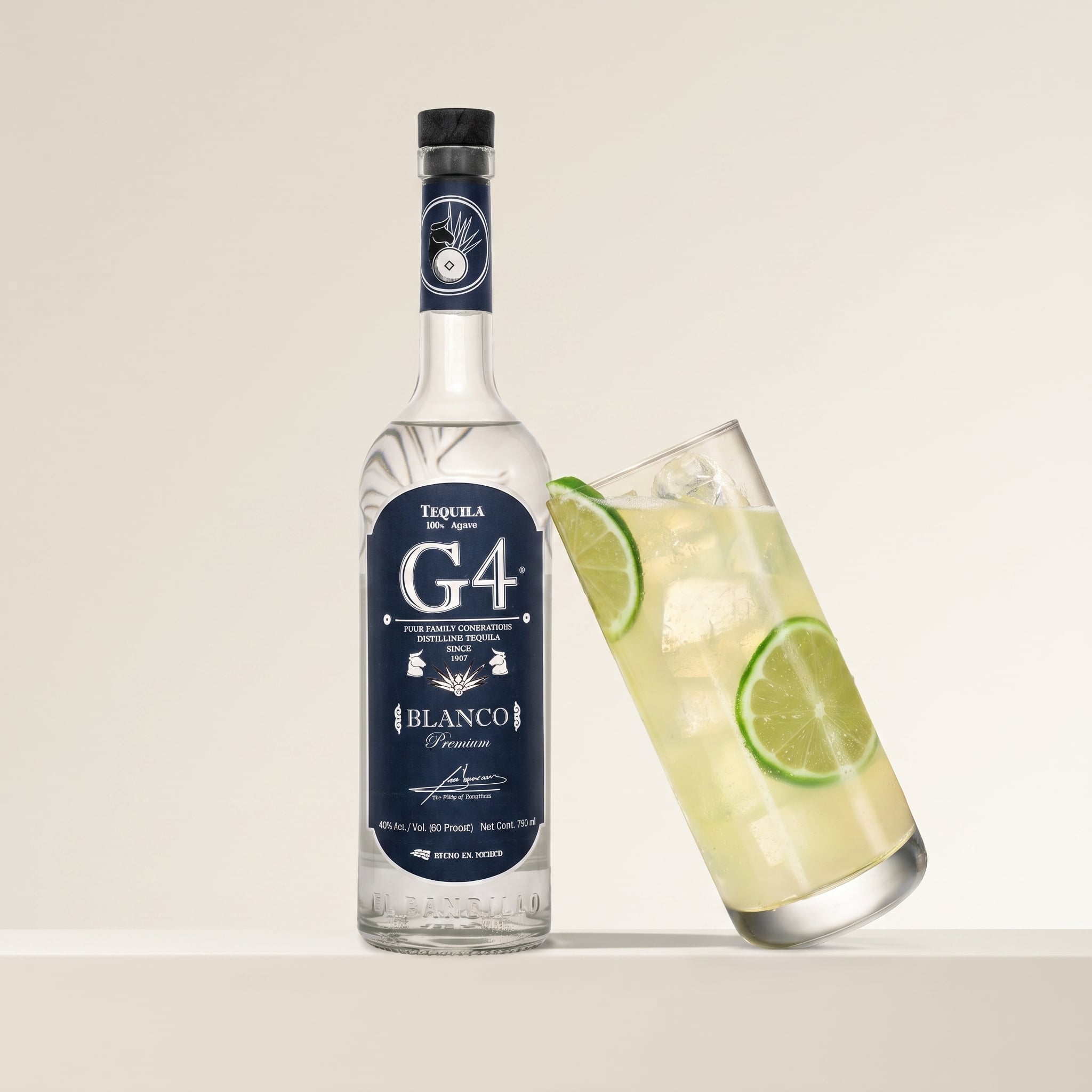 Load image into Gallery viewer, A bottle of G4 Tequila Blanco stands next to a clear highball glass filled with a pale yellow cocktail and lime slices, set against a clean off-white background.
