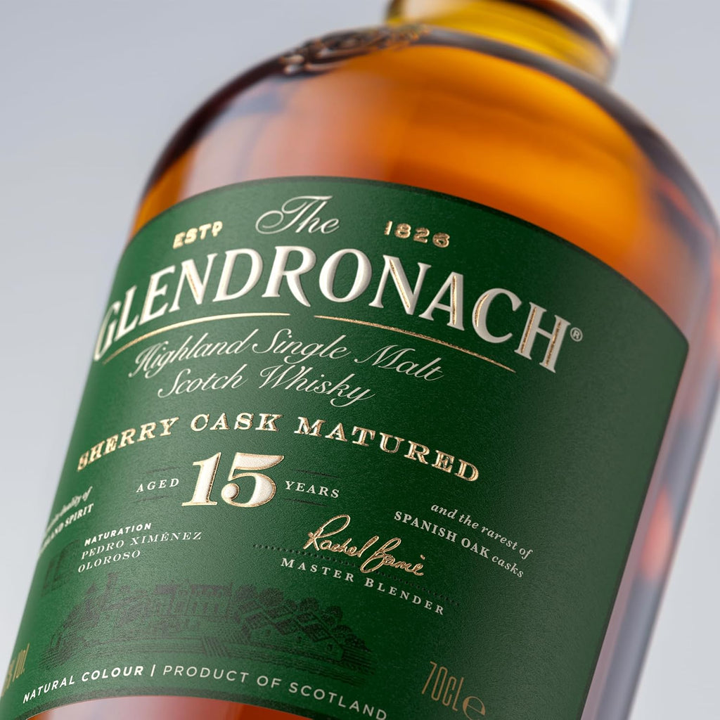 Glendronach 15 year old whisky bottle with green label on a gray background