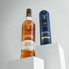 Load image into Gallery viewer, Glenfiddich 12 year old whisky bottle and packaging on a gray background