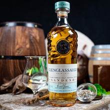 Load image into Gallery viewer, Bottle of Glenglassaugh Sandend whisky with a glass and barrel in the background