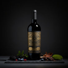 Load image into Gallery viewer, A bottle of Gran Sasso Colline Teramane Montepulciano Alta Quota wine next to chocolates and black berries