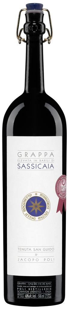 A bottle of Grappa di Bolgheri Sassicaia with a label displaying the brand and other information, set against a plain background.
