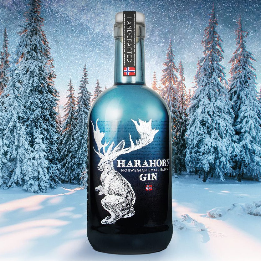Load image into Gallery viewer, Harahorn Norwegian Small Batch Dry Gin 1000ml bottle in a snowy forest with Christmas message