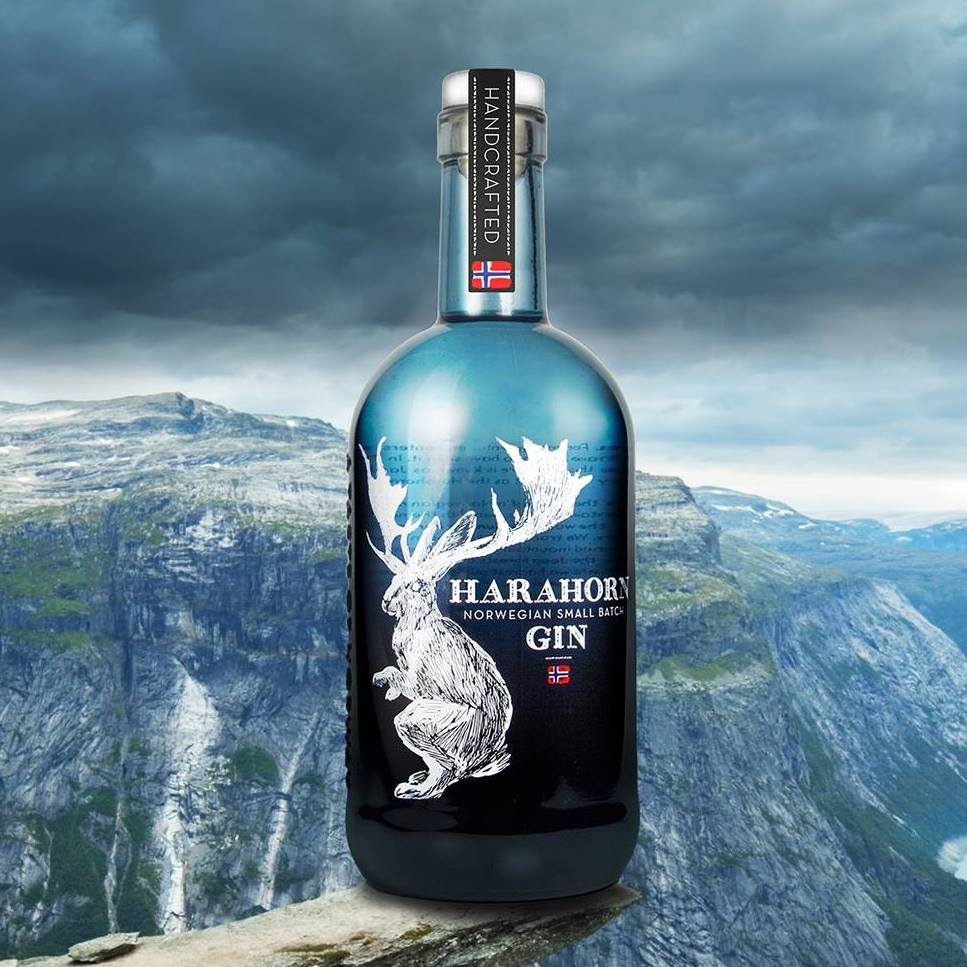 Load image into Gallery viewer, Bottle of Harahorn gin with a stag design on a mountainous background