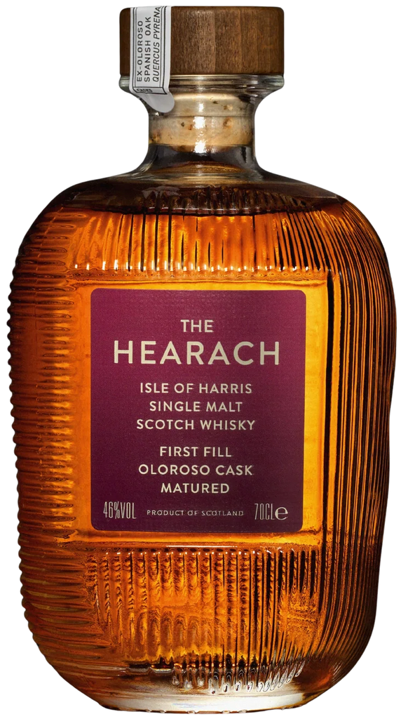 A 700ml bottle of The Hearach Isle of Harris Sherry cask Single Malt Scotch Whisky, featuring a ribbed clear glass body showing the amber-brown whisky inside, a dark purple label with gold lettering, and a wooden stopper.