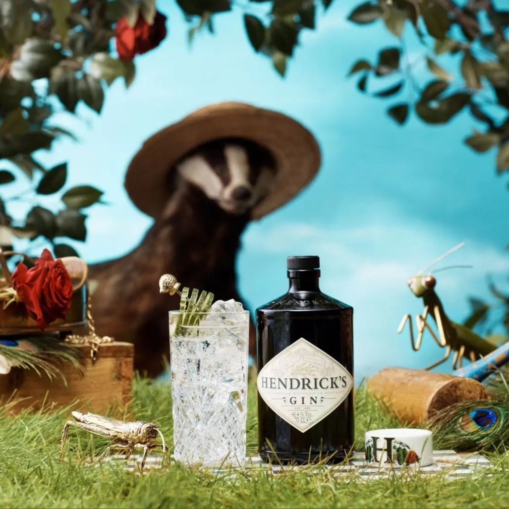 Load image into Gallery viewer, Hendrick's gin bottle with a badger in a garden setting