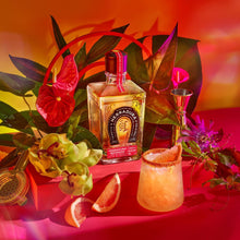 Load image into Gallery viewer, Bottle of Herradura Reposado tequila with a cocktail and flowers on a vibrant background