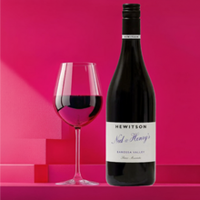 Load image into Gallery viewer, Hewitson-Ned-Henry-Shiraz bottle and glass of red wine with &#39;Hewitson&#39; label on a pink background