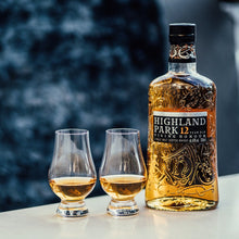 Load image into Gallery viewer, Highland Park whisky bottle with two glasses on a blurred natural background