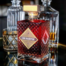 Load image into Gallery viewer, Bottle of L.W. Harper 15 year old bourbon whiskey with a gold label on a reflective surface.