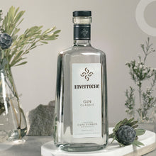 Load image into Gallery viewer, Inverrhoche Gin bottle on a marble coaster with decorative plants in the background