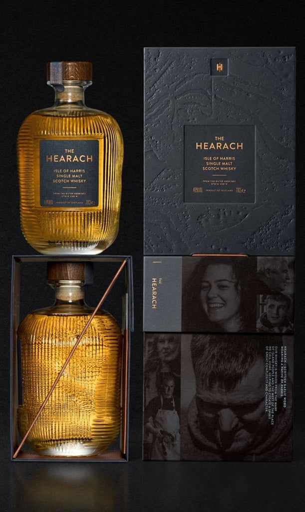 An image of a stunning bottle of Isle of Harris 'The Hearach' Single Malt Whisky 700ml next to its beautiful gift box & an additional image of the side view of this stunning bottle