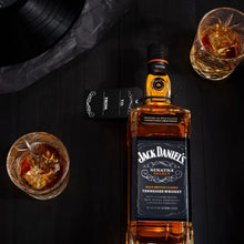 Load image into Gallery viewer, Jack Daniel&#39;s whiskey bottle with two glasses of whiskey on a dark surface