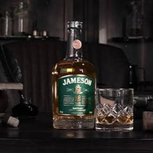 Load image into Gallery viewer, Jameson whiskey bottle with a glass of whiskey on a bar counter