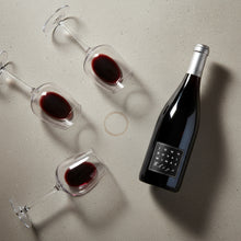 Load image into Gallery viewer, Bottle and glasses of red wine with &#39;John Duval&#39; label on a light gray surface