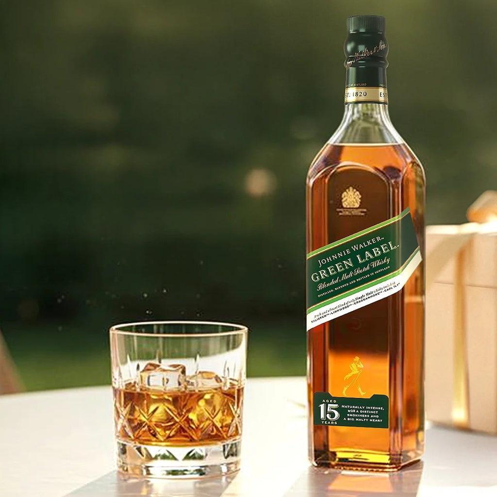 Johnnie Walker Green Label bottle with a glass of whiskey on a blurred green background