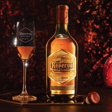 Load image into Gallery viewer, Bottle and glass of Jose Cuervo Reserva De La Familia Tequila Extra Anejo on a dark background