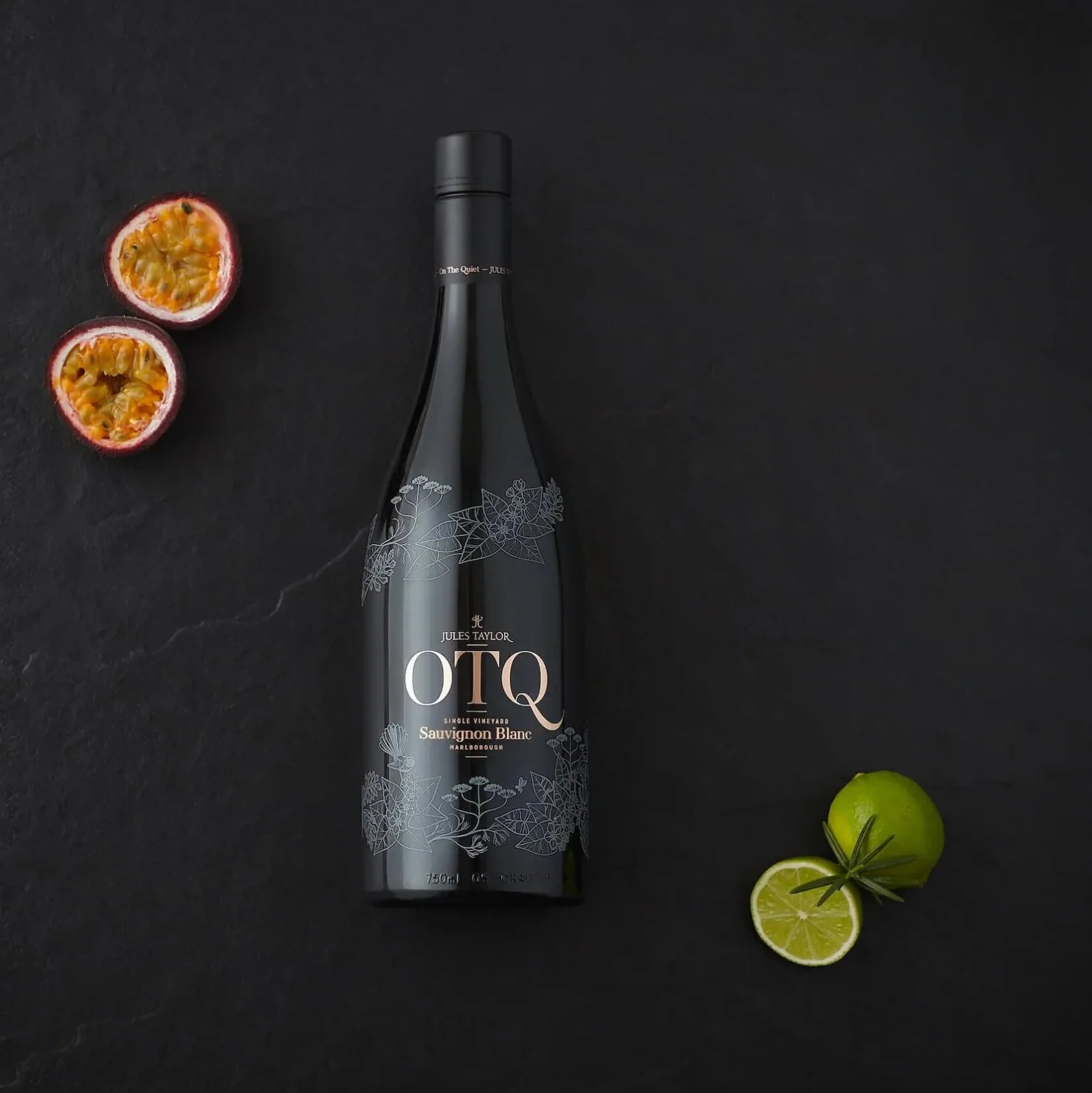 Load image into Gallery viewer, A bottle of white wine on a black bakground.