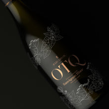 Load image into Gallery viewer, Wine bottle with &#39;OTQ&#39; label on a dark background