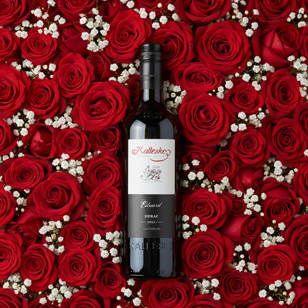 Load image into Gallery viewer, Bottle of Kalleske Eduard Shiraz red wine surrounded by red roses and white flowers
