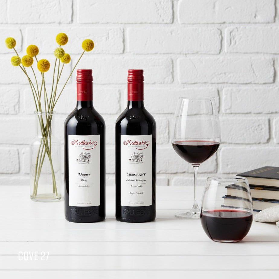 Load image into Gallery viewer, Two bottles of KALLESKE Cabernet Sauvignon and Shiraz with a glass of wine on a white surface.