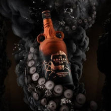 Load image into Gallery viewer, Kraken bottle surrounded by bubbles and octopus tentacles on a dark background