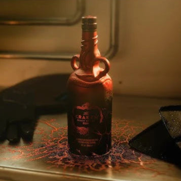 Bottle of Kraken Black Spiced Rum on a wooden surface with a dark background