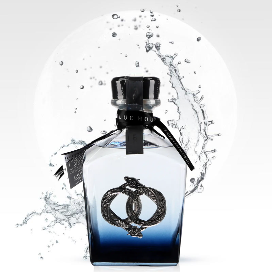 Load image into Gallery viewer, Blue bottle of La-Hora-Azul-Blue-Hour-Blanco-Tequila with water splash on a white background
