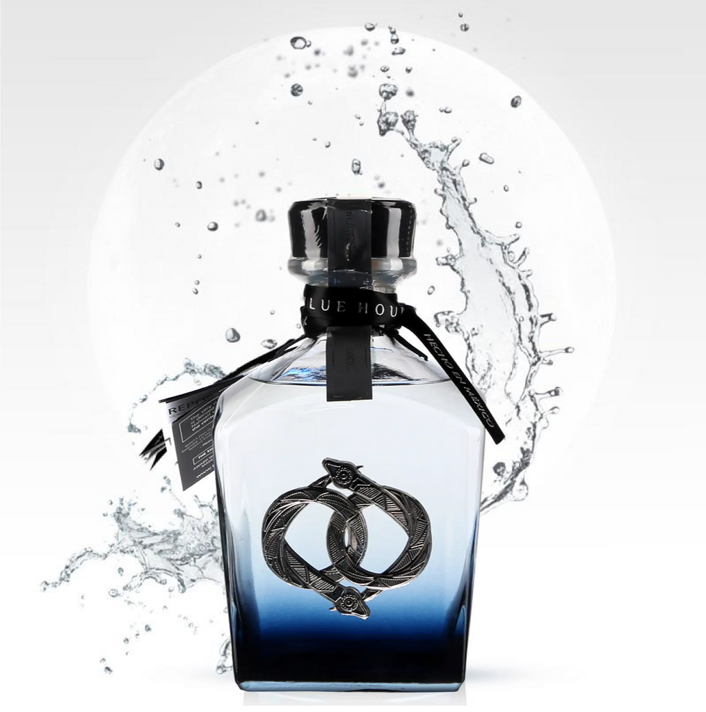 Blue bottle of La-Hora-Azul-Blue-Hour-Blanco-Tequila with water splash on a white background