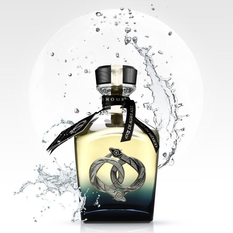 Bottle of La-Hora-Azul-Blue-Hour-Reposado-Tequila with water splash effect on a white background