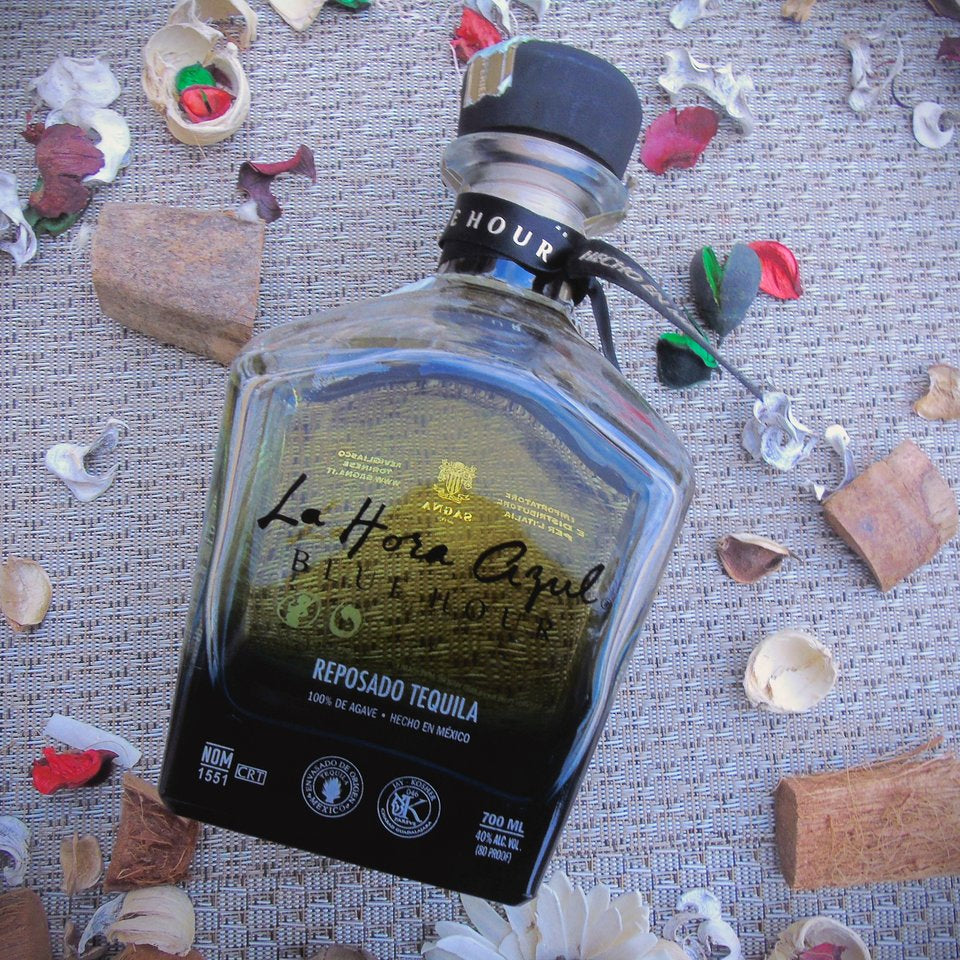 La-Hora-Azul-Blue-Hour-Reposado-Tequila bottle with decorative elements on a textured surface