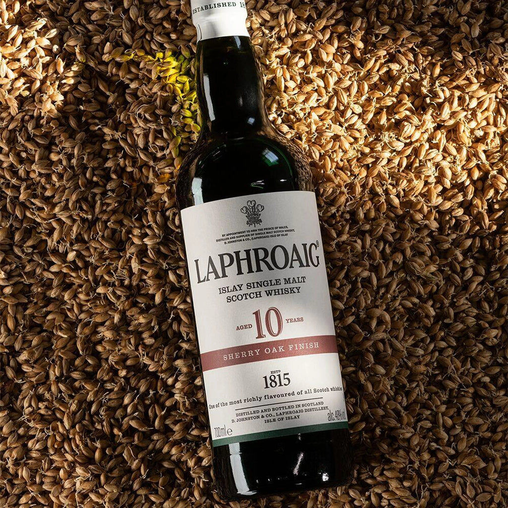 Laphroaig whisky bottle on a bed of barley