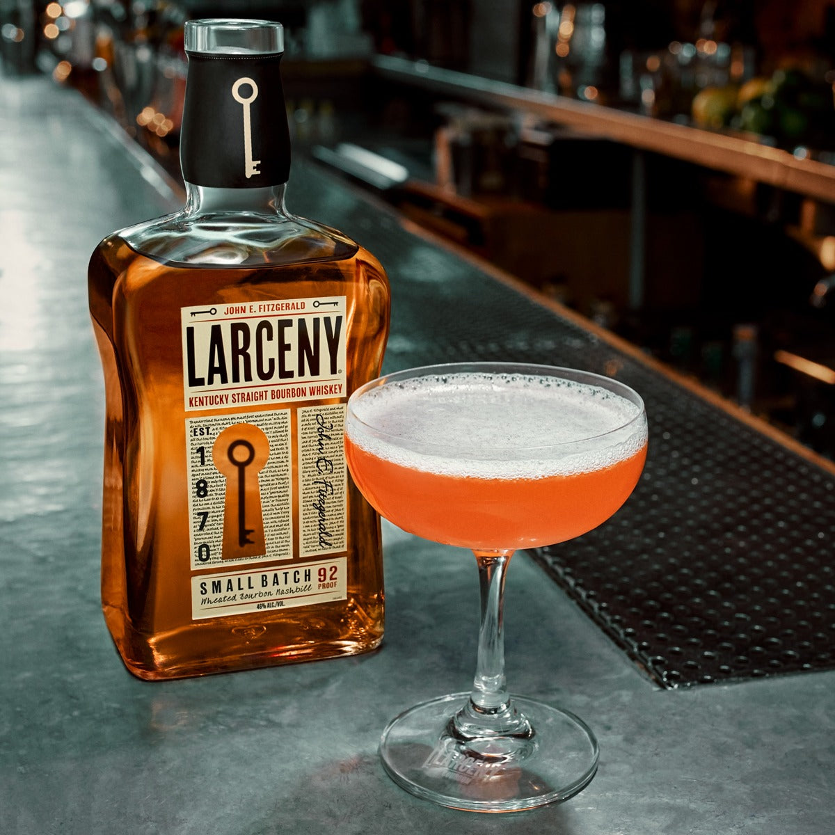 Load image into Gallery viewer, Larceny Kentucky Straight Bourbon Whiskey in a bar with a whiskey cocktail